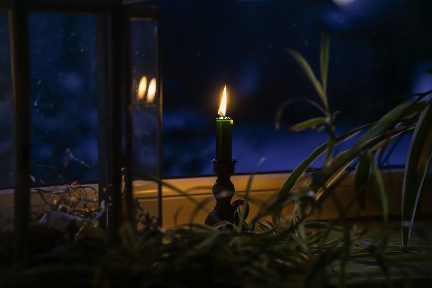 Quiet candlelit room representing a mindful evening environment